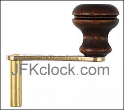 crank-style winding key with light-colored handle