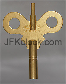 A brass, wing-style, double-ended Waterbury key